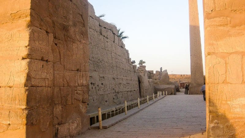 Pathway between ancient walls with hieroglyphs in Karnak Temple, Luxor.