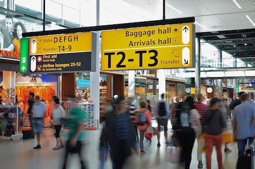 Airport Signage and Busy Terminal