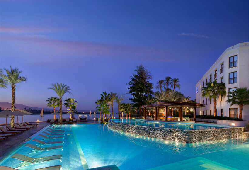 Hilton Luxor Resort with a luxurious pool area and views of the Nile River