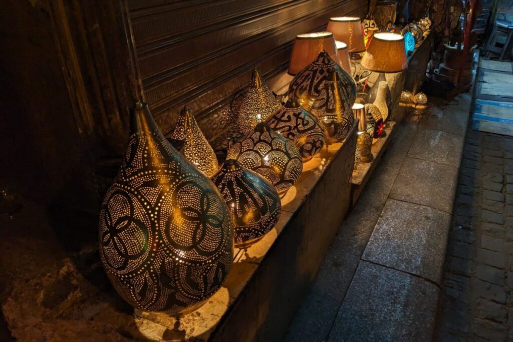 A vibrant view of Khan el-Khalili Bazaar, featuring colorful shops, traditional lanterns, and bustling crowds in Cairo