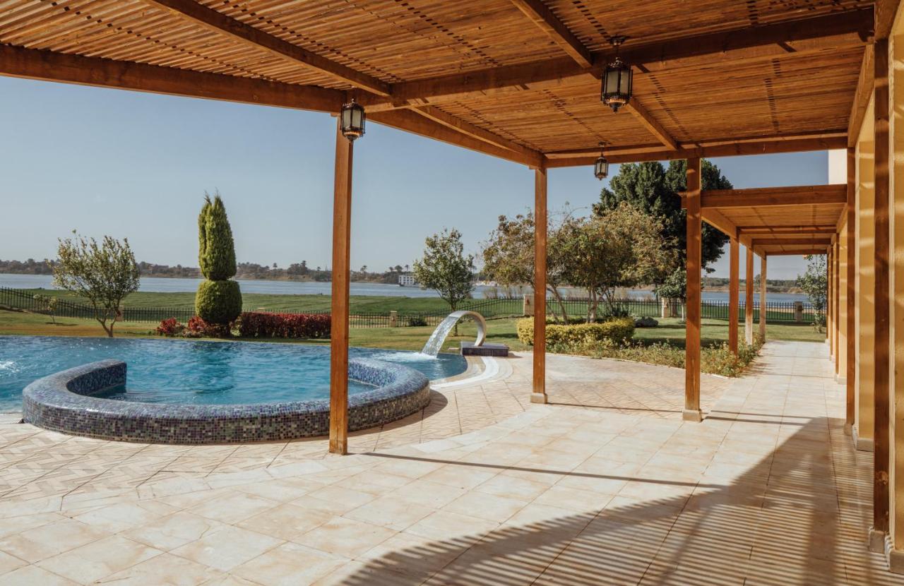 Maritim Jolie Ville Kings Island Hotel in Luxor with a luxurious pool area and lush green surroundings