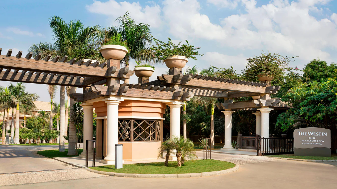 Luxurious pool area at Westin Cairo Golf Resort & Spa with palm trees and sun loungers